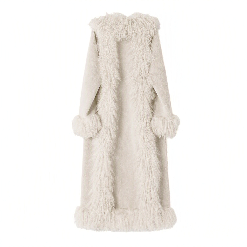 A long, cream-colored mongolain fur coat with a shawl collar, long sleeves, and matching pom-pom cuffs